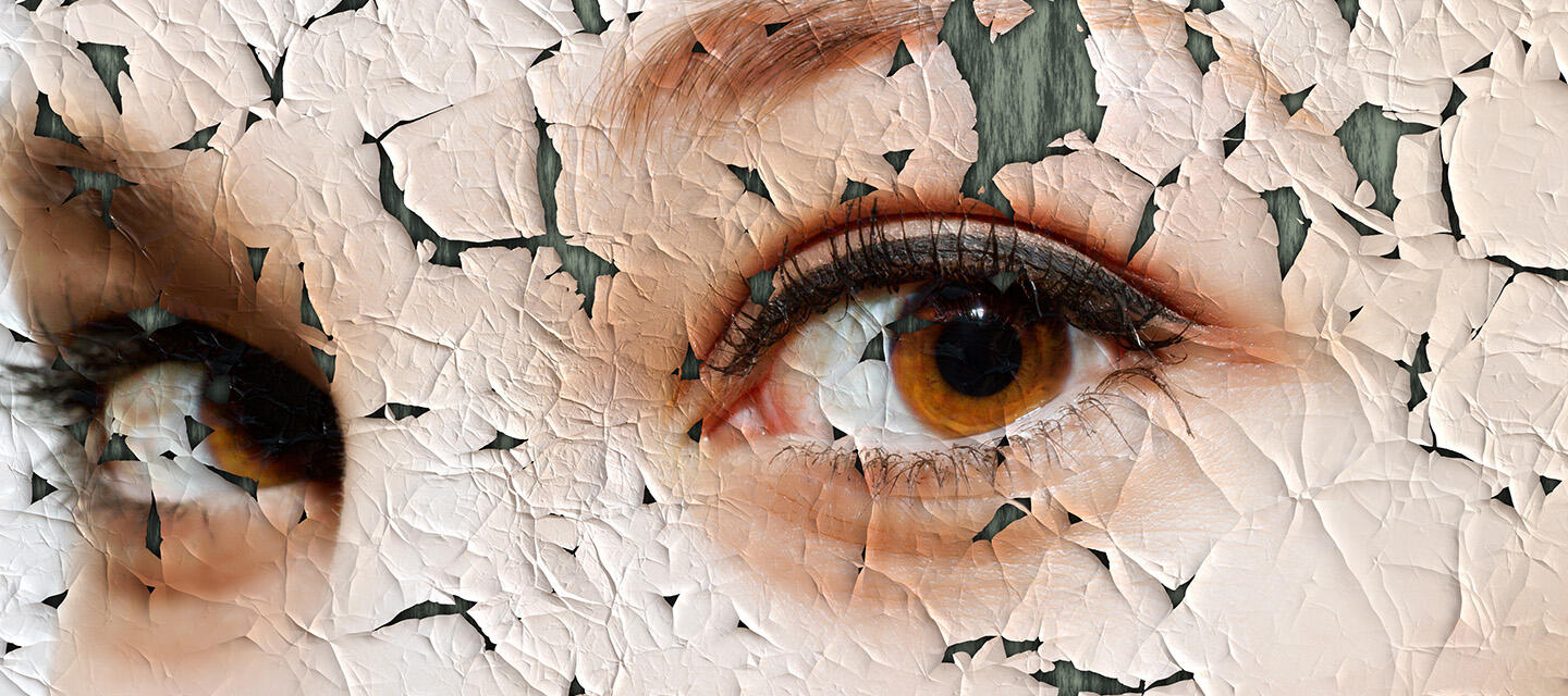 A close-up of a woman's beautiful brown eyes on an old oil painting that is cracking and pealing